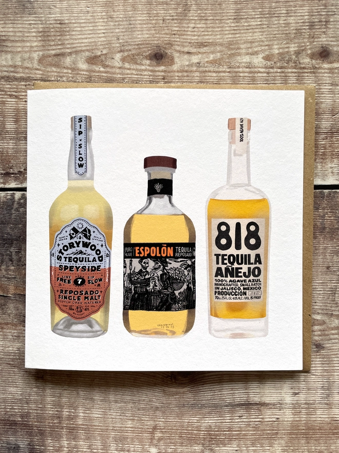 Illustrated greetings card featuring three bottles of tequila, blank inside.