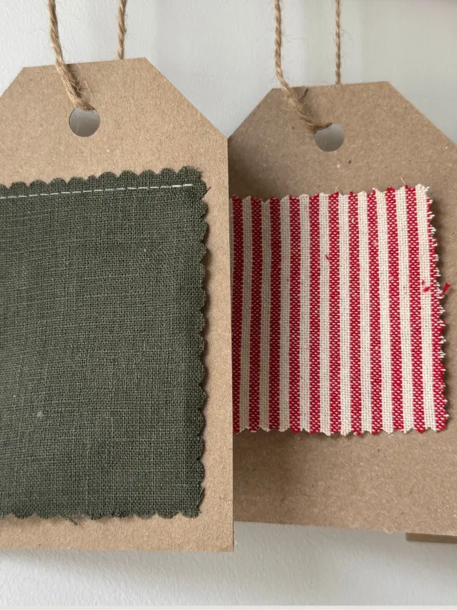 Striped Embroidered Christmas Stocking. A selection of plain and patterned linens on a swatch