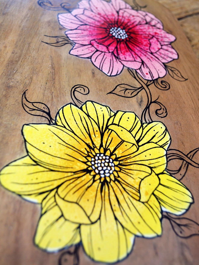 Detail of handpainted serving board with a design of roses