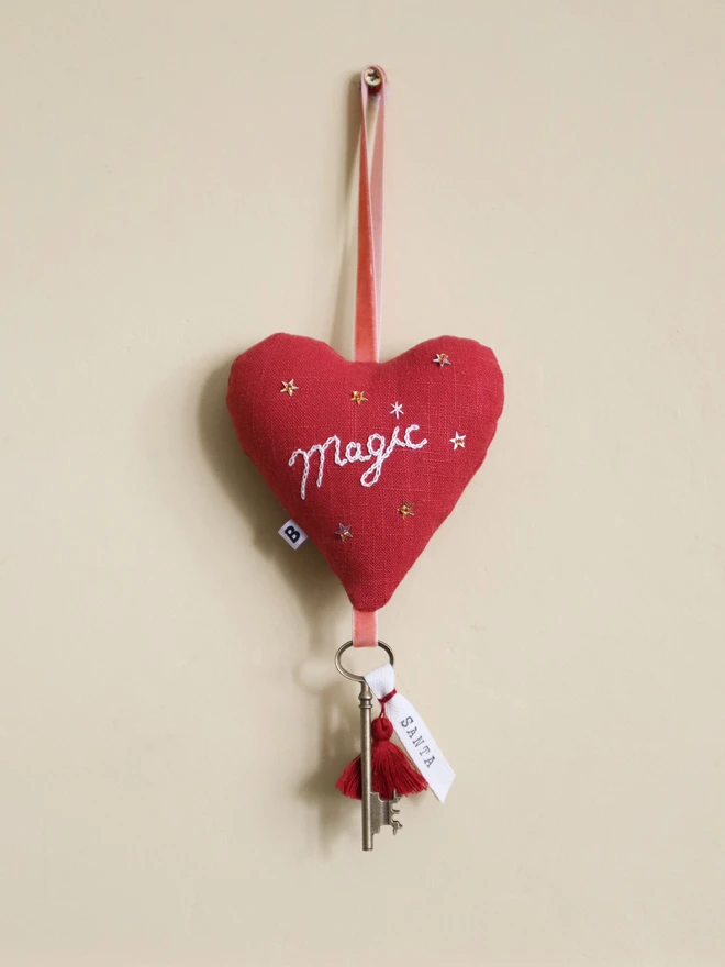 Linen heart ornament with Magic embroidery, hanging rustic key with Santa's name tag and red tassles