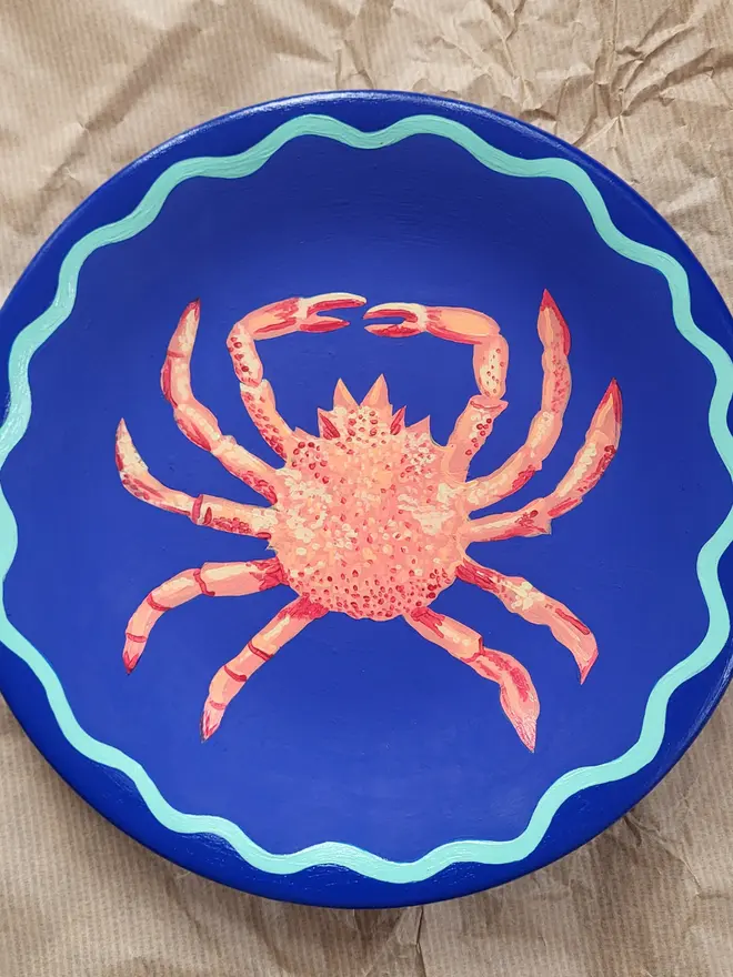 Cobalt Blue Plate with coral orange spider crab 
