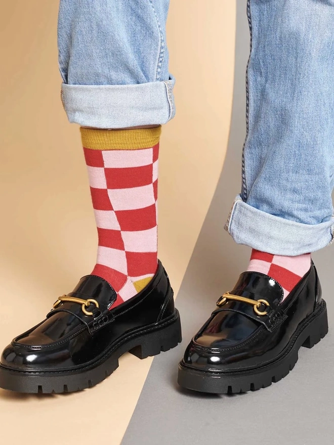 Women's Battenburg Organic Cotten Ankle Socks, a woman wearing a pair of colourful patterned socks. 
