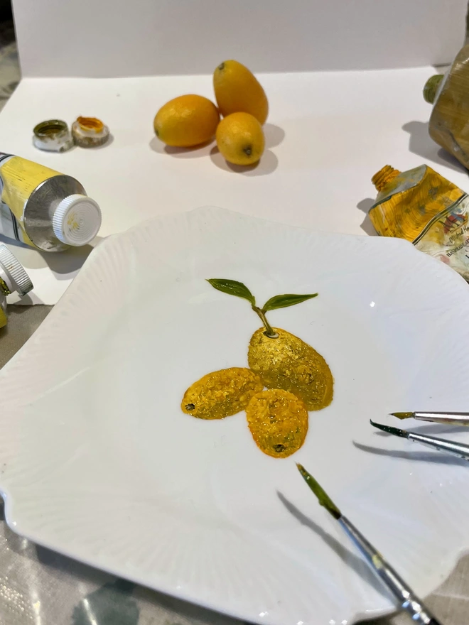 painting kumquats in the studio