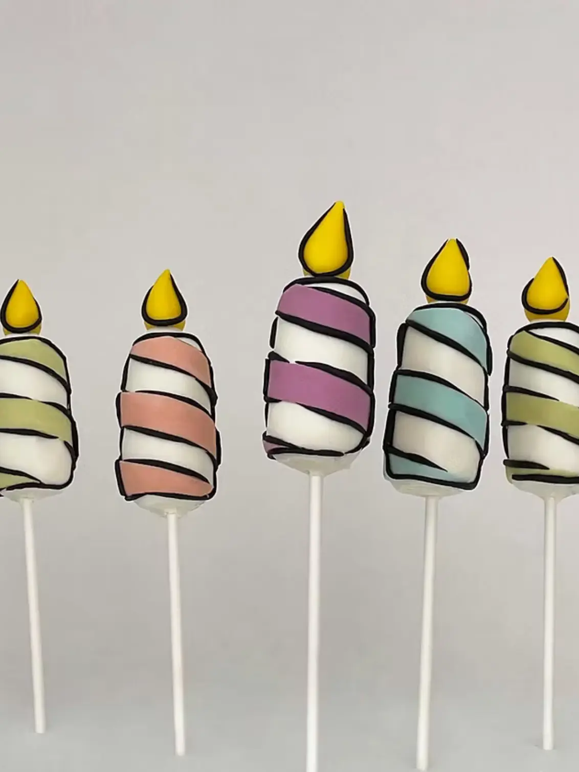 5 Cartoon Birthday Candle Cake Pops in various colours