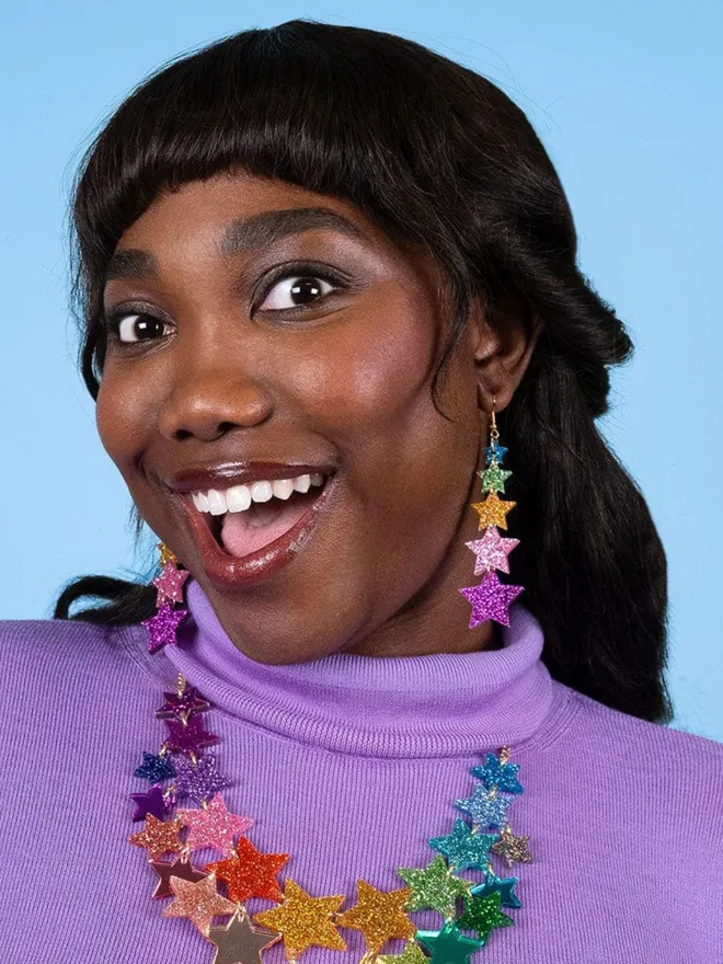 Super Star Earrings and Matching Necklace on a model