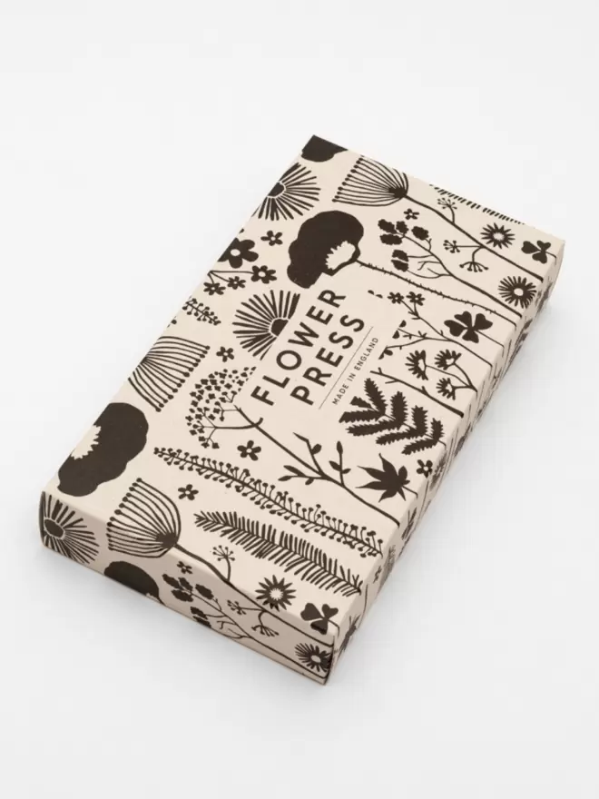 Monochrome floral illustration packaging for flower press