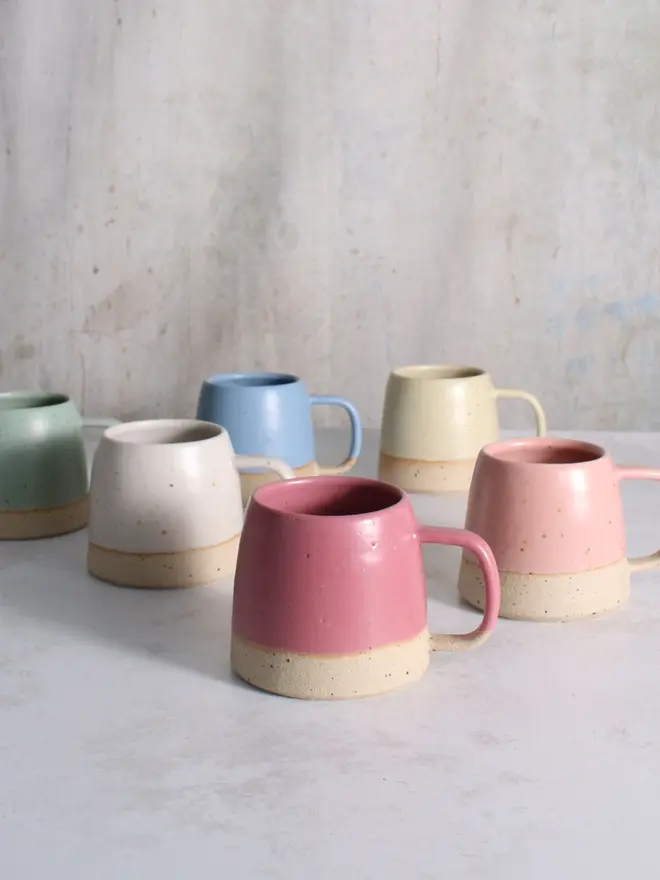 Our stoneware mug collection in mint green, cornflower blue, pale yellow, off-white, pale pink and fuchsia.