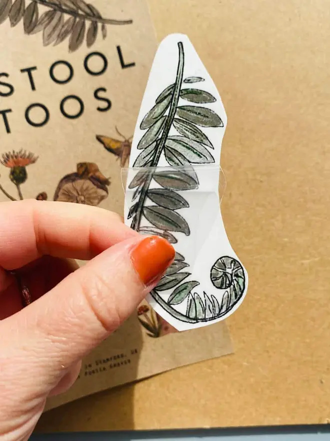 Nature Botanical Temporary Tattoos, temporary tattoo of a green fern frond with a curled fiddlehead bottom.