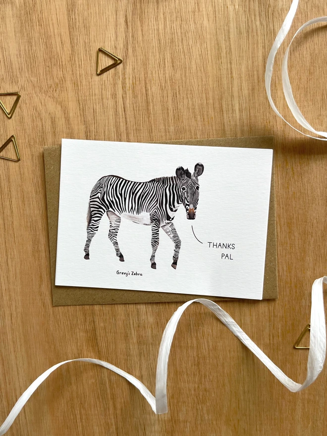a greetings card featuring an illustration of a zebra with the text “thanks pal”