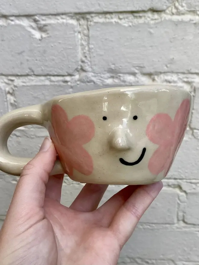 pink flower handmade ceramic smiley face mug