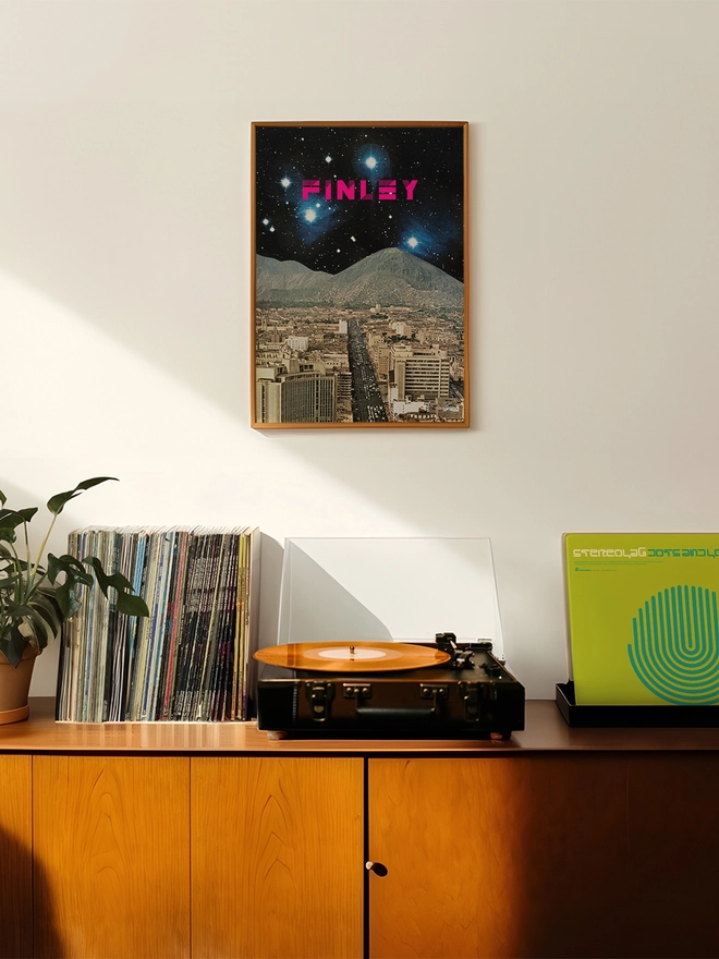 A personalised retro space print featuring a faraway planet deep in space. A bold name in hot pink sits among the stars.