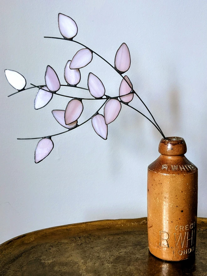 Pink glass flowers in jar