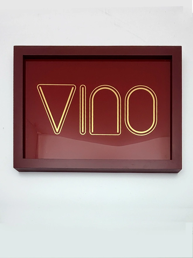 'Vino' Wine Serie Gold Leaf Glass Artwork, hanging in an exposed brick wall. 