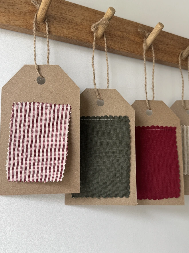 Striped Mini Christmas Stocking. red striped Fabric swatches on card 