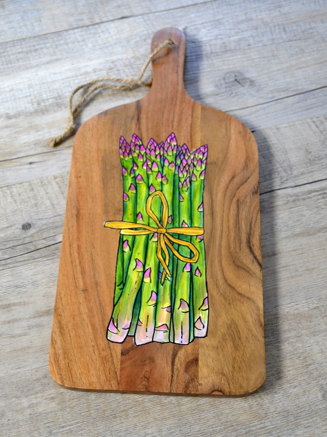 Wooden serving board with handpainted asparagus design