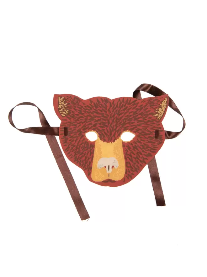 White cut-out shot: brown bear mask with cutout eyes and brown ribbon