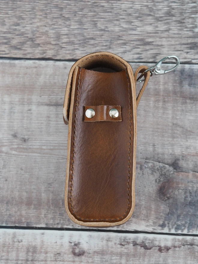 Handmade leather golf tee and golf ball carrying case. With a clip for ease of use when out golfing