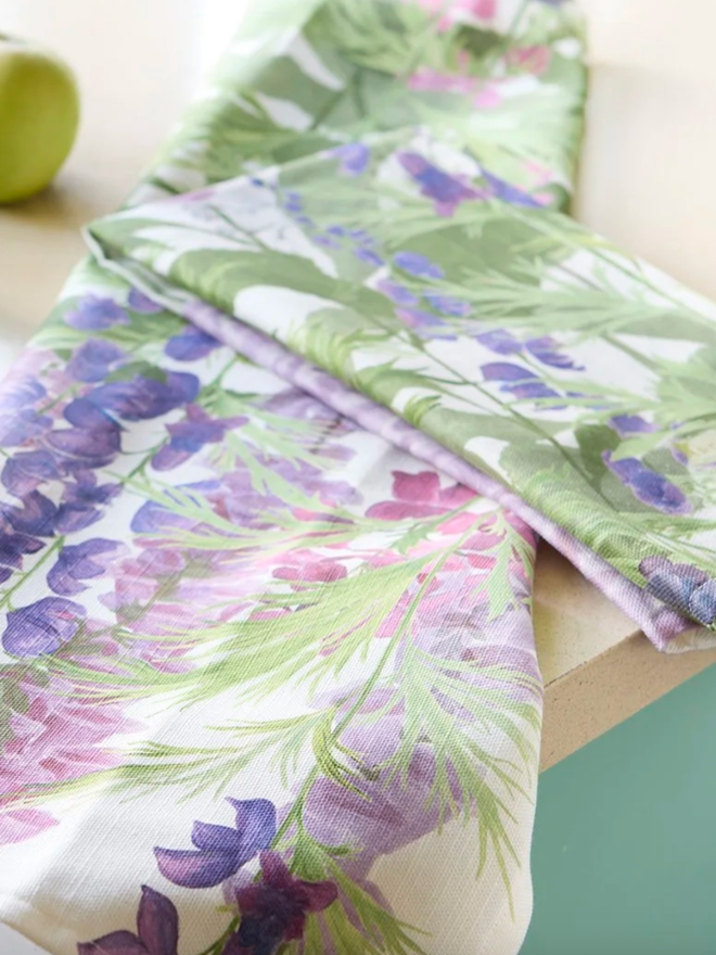 Horatio’s Garden Tea Towel. A tea towel patterned with foxgloves.