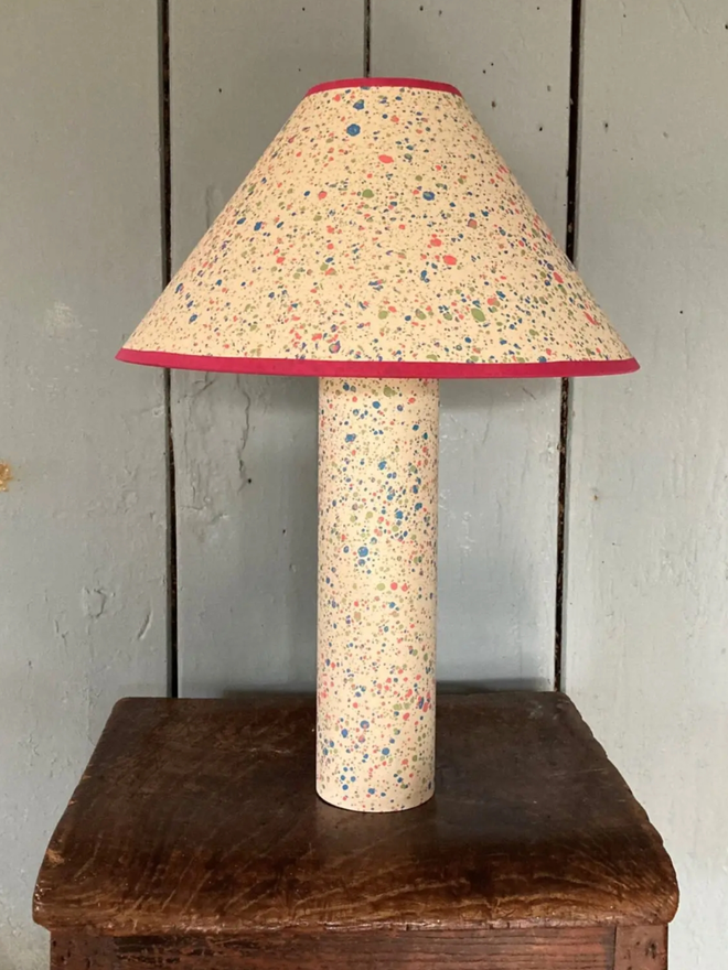 Marbled on Marbled Base & Shade. A yellow lampshade and base on a table.