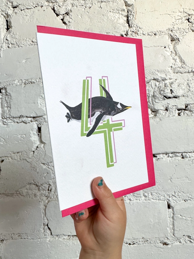 a white card with a big green number 4 and a penguin illustration with a neon pink envelope