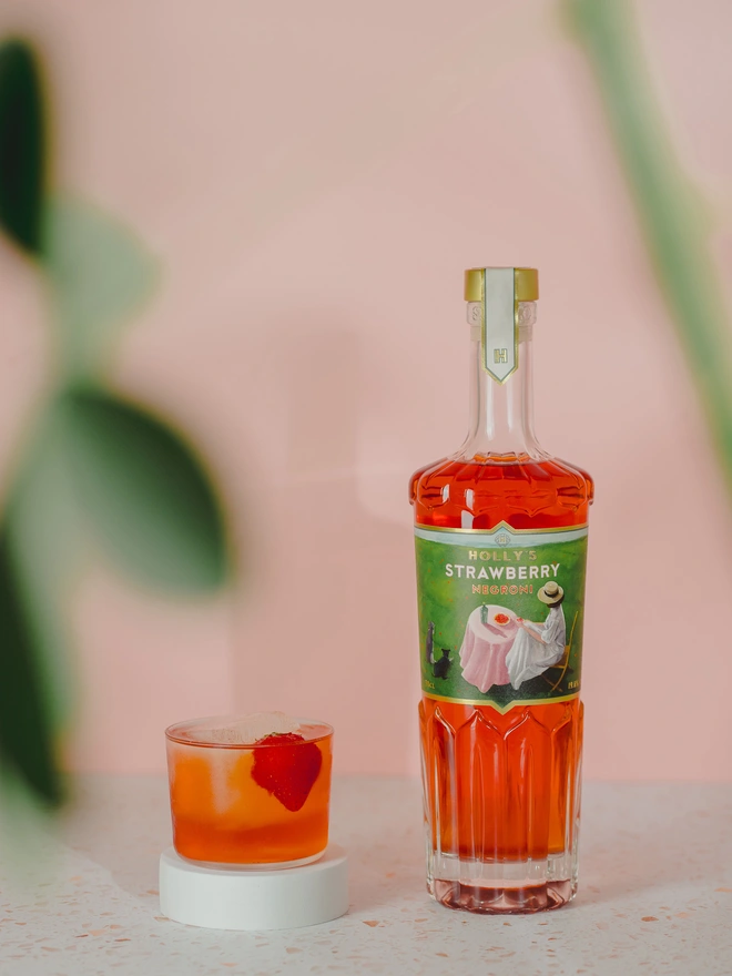 Strawberry Negroni bottle and Cocktail Serve