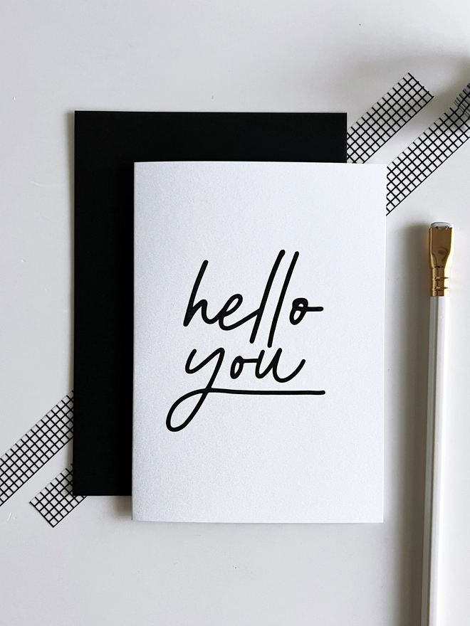 Minimal black and white greetings card with “hello you” script design