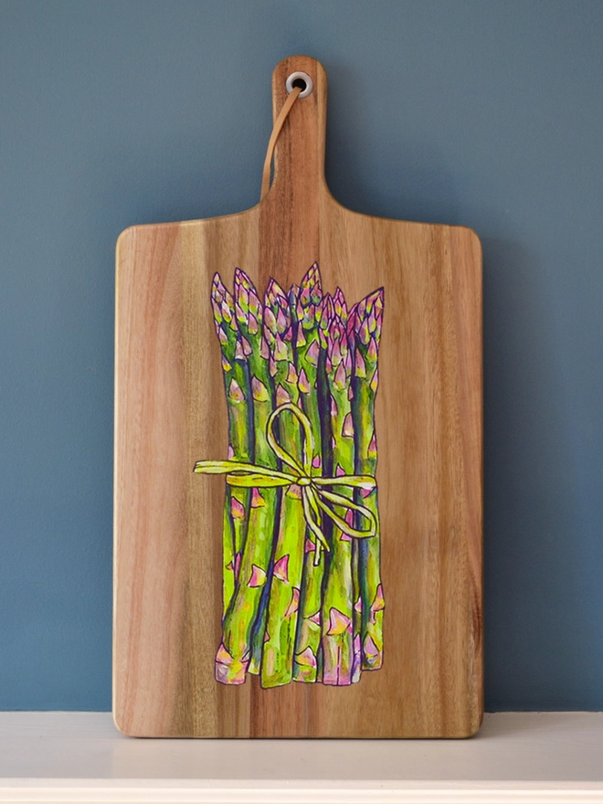Wooden serving board with handpainted asparagus design