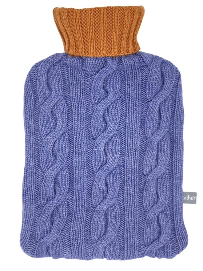 Cashmere Hot Water Bottle Cover, a colourful water bottle sitting on a white plain surface. 