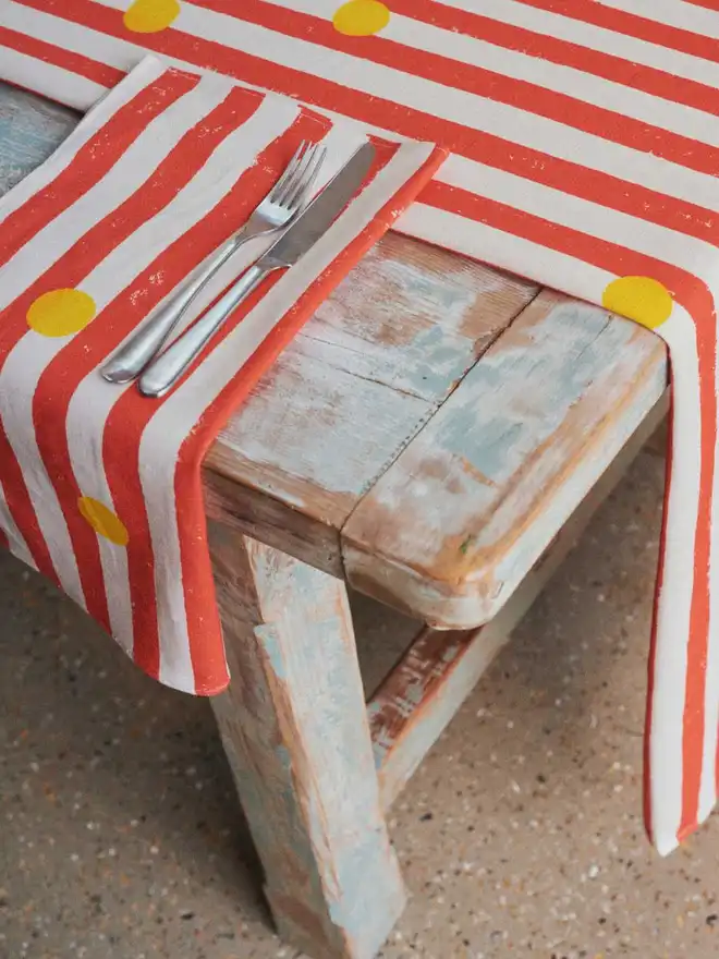 Red stripe yellow dot table runner