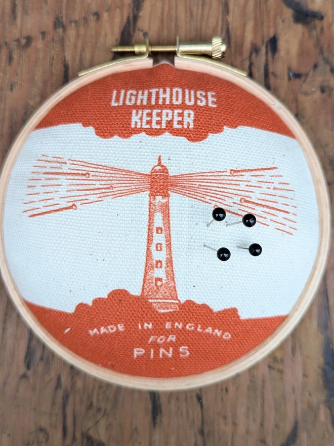 Orange lighthouse keeper pin cushion