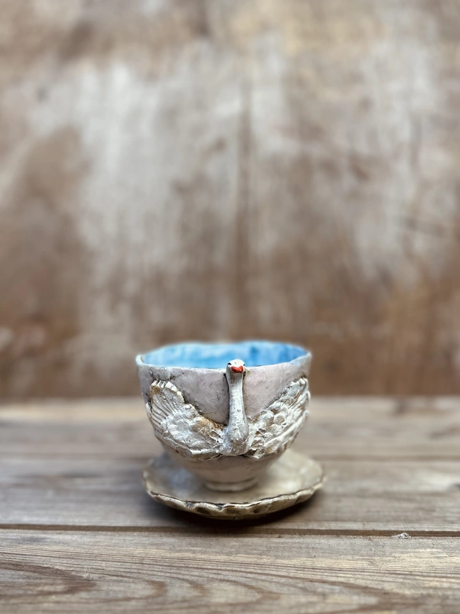 Rustic swan cup and saucer