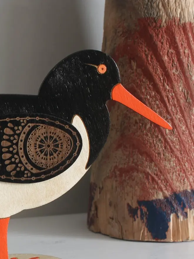 Standing Wooden Oyster Catcher, wooden bird decoration standing on a platform. 