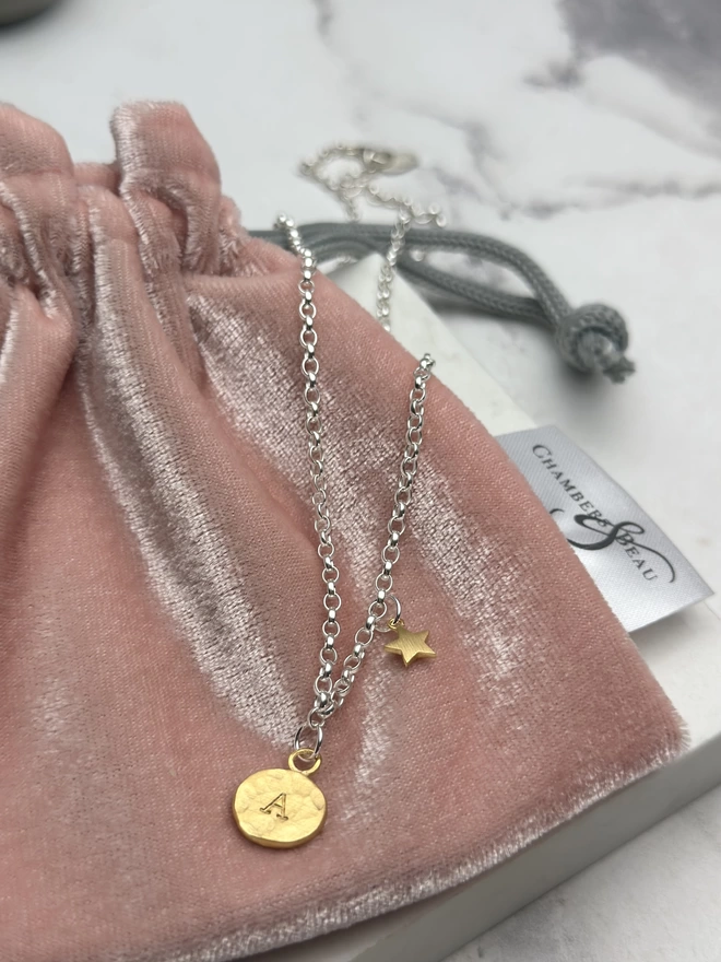 sterling silver chain with personalised gold circular charm and mini gold star