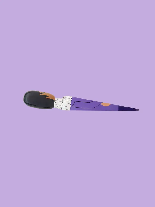 Wooden Door Stopper (The Purple One), a colourful wooden door stop sitting on a white surface. 