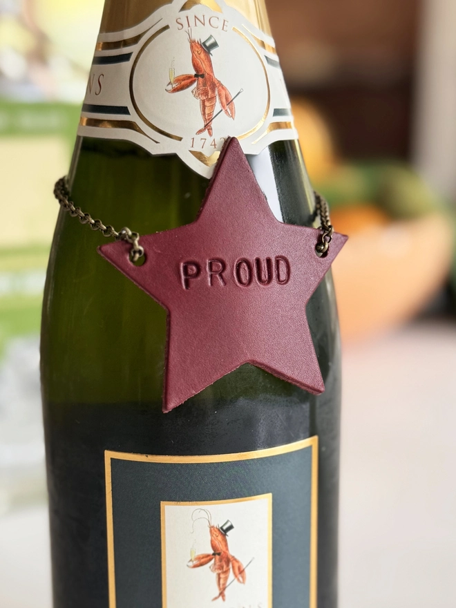red leather bottle tag star