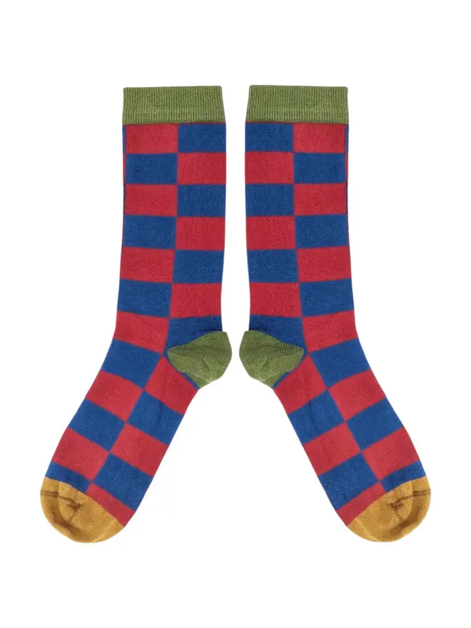 Men's Battenburg Check Organic Cotten Ankle Socks, a pair of colourful patterned socks sitting on a plain white surface. 