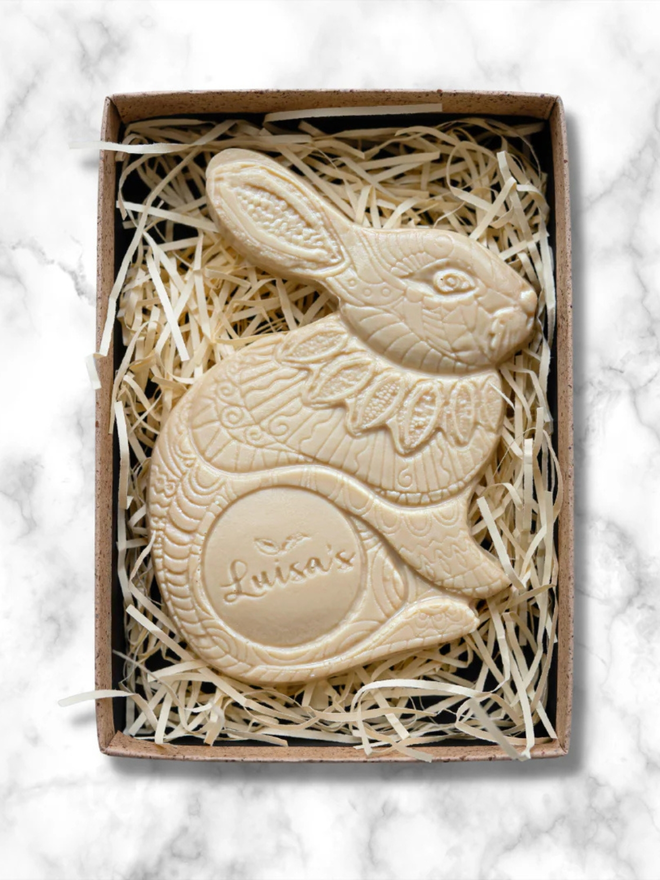 Vegan White Casholate Luigi Chocolate Bunny in a box with straw bedding