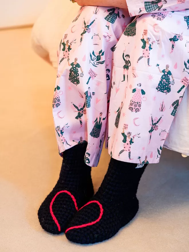 Handmade socks with a heart embroidered on to the top