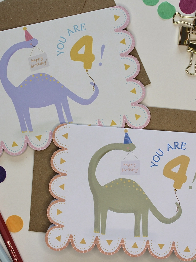 illustrated dinosaur 4th birthday card. scallop edged card 