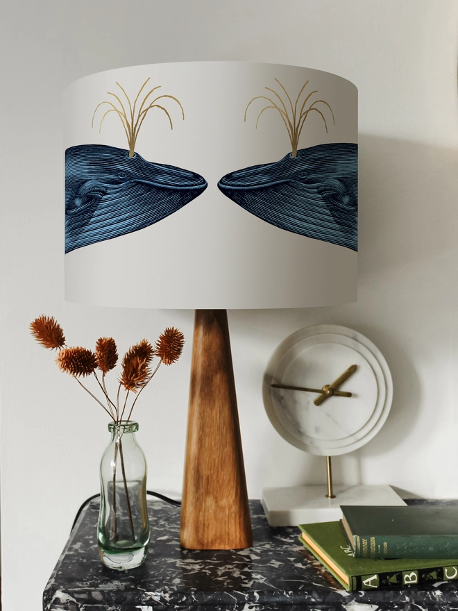Handmade blue whale lampshade with gold details featuring vintage inspired ocean artwork