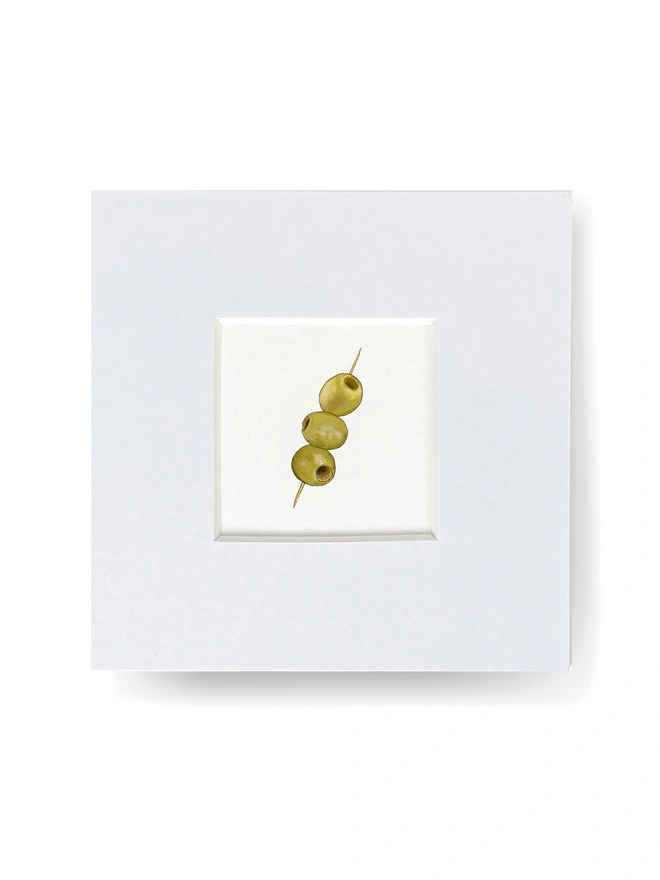 Tiny print with white mount featuring three olives on a stick