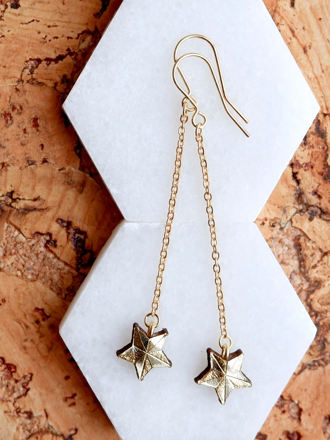 tiny gold leather star drop earrings
