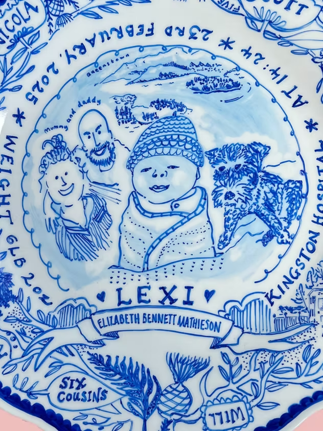 new baby scalloped dinner plate. a blue and white commemorative dinner plate to celebrate a newborn.