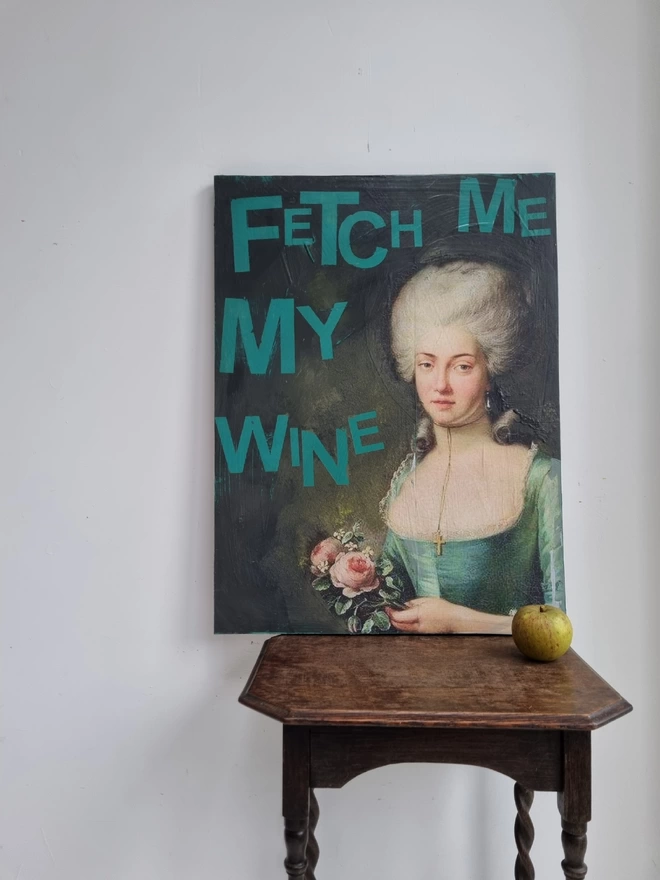 Painted and decoupage art panel featuring an antique portrait of an aristocratic lady and jade green wording that reads ‘fetch me my wine’