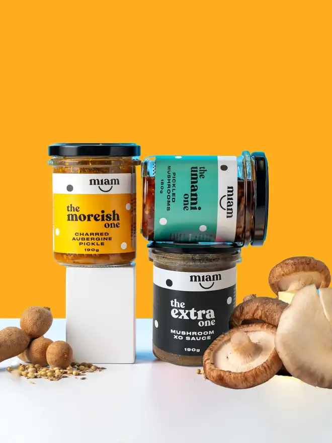 trio of flavoured jars on an orange background