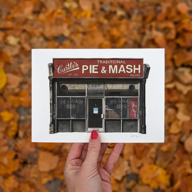 Camden Castle's Pie & Mash Shop Giclée Print (Unframed), a print of a shop held in front of a colourful backdrop. 