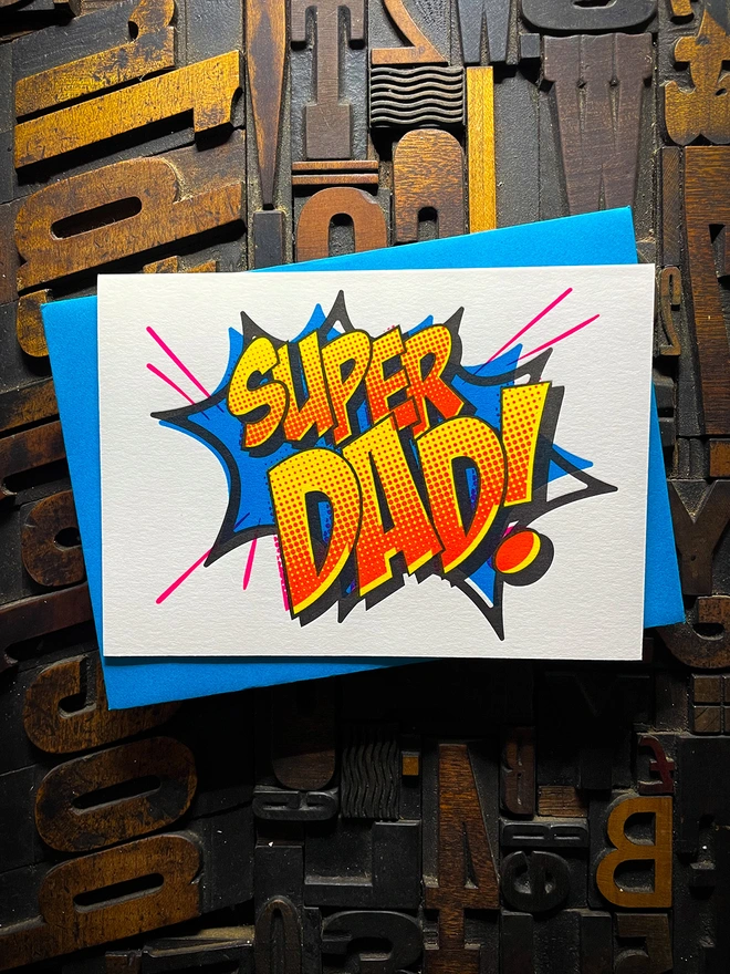 Pop Art Fathers day typographic letterpress card with fluorescent ink made by hand. Deep impression print. Unique with no print being the same. Vibrant colours with matching premium envelopes. With luxurious contrasting coloured envelopes.