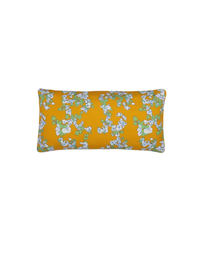 yellow floral cushion on blank background