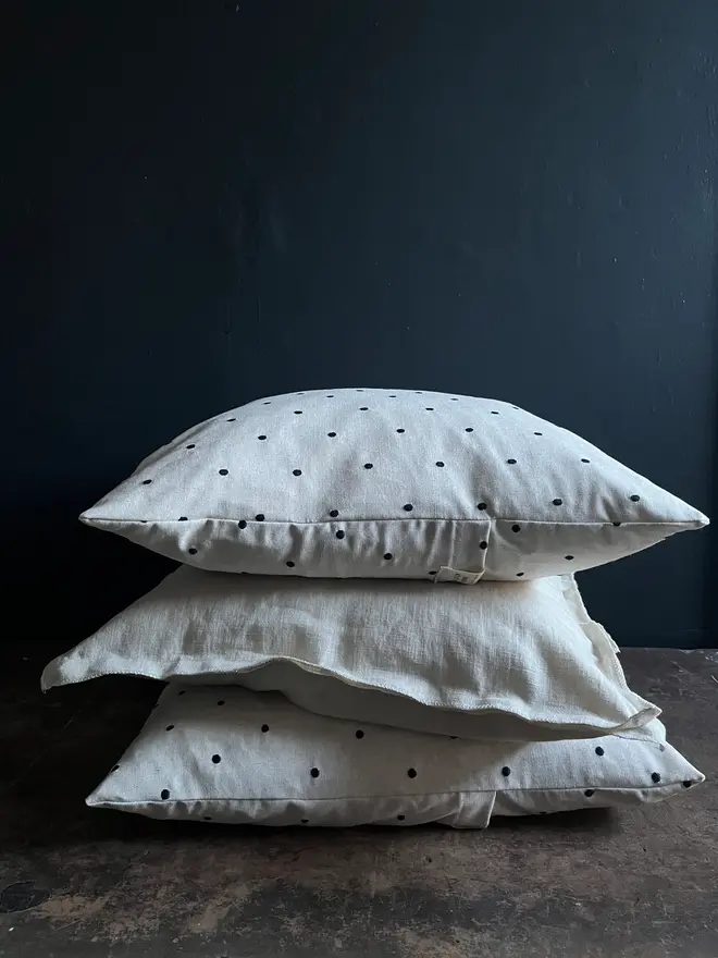 spotty feather filled linen cushions