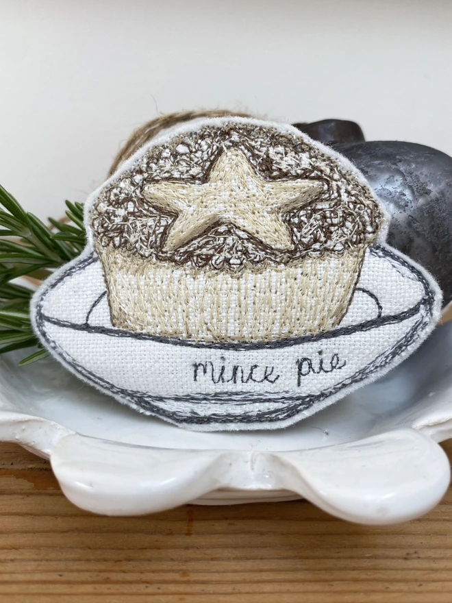 Embroidered Mince Pie Fabric Decoration on a plate